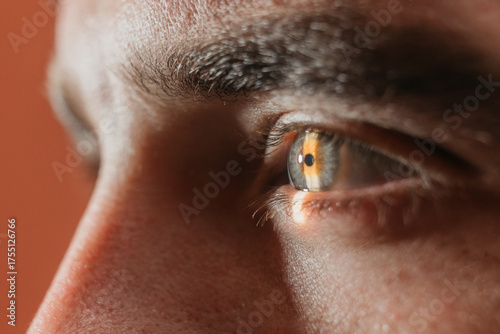 Close-up of a human eye showcasing intricate details, highlighting the cornea and iris during an ophthalmology examination with slit lamp equipment for vision assessment