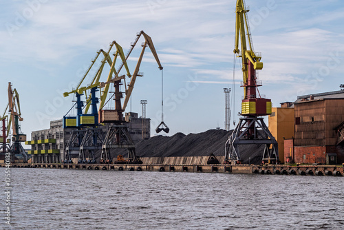 Coal terminal in the port. Large cranes at the coal handling terminal