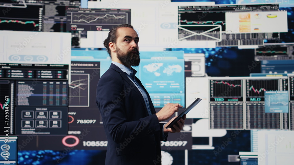 Fototapeta premium Company administrator searching for a new solution to obtain business growth, working hard for success while he analyzes all reports and KPI metrics. International expansion. Camera B.