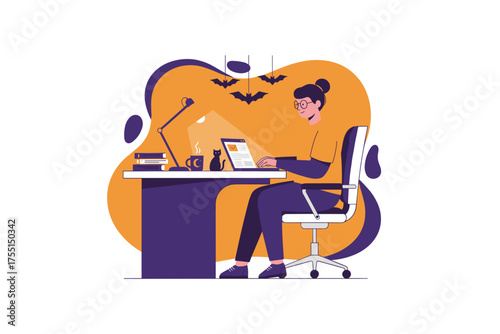 Woman focused on laptop at home office desk with cat and Halloween decor Remote work creativity concept
