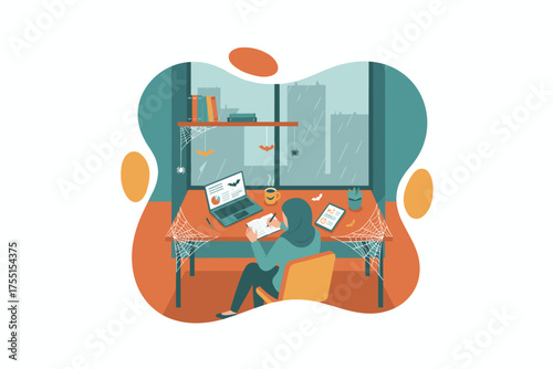 Woman in hijab working at a desk with laptop tablet  coffee rainy city outside Halloween decor
