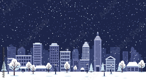Winter city landscape with snow-covered buildings and trees at night  