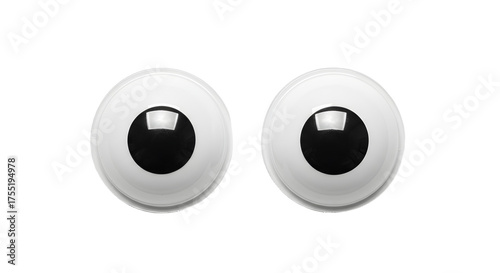 Pair of black and white plastic googly eyes isolated on white background, perfect for crafts and DIY projects