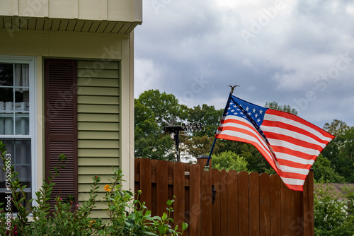 american flag in front of house