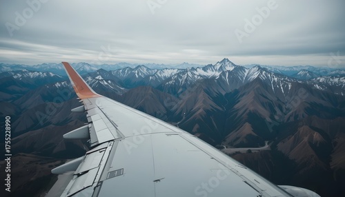 Breathtaking snow capped mountains from airplane window, adventure travel and aviation inspiration, perfect for wanderlust and scenic vistas