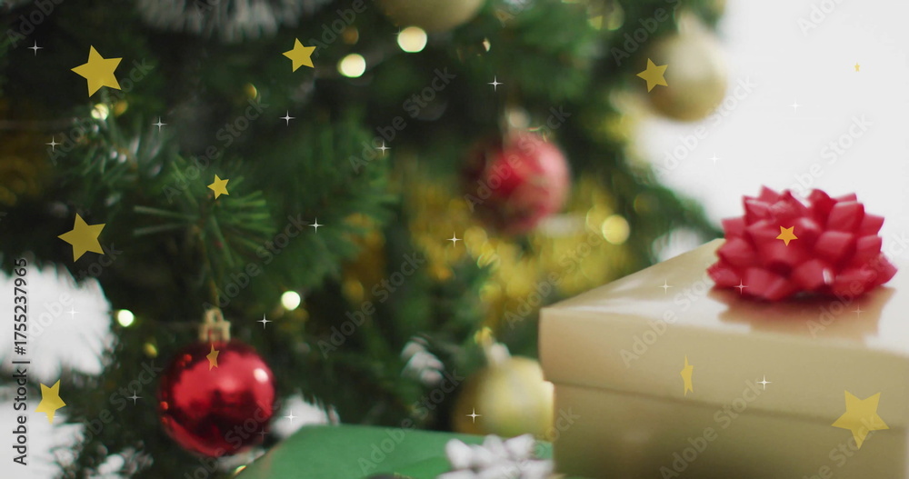 Naklejka premium Christmas tree with ornaments and gift boxes over falling stars image