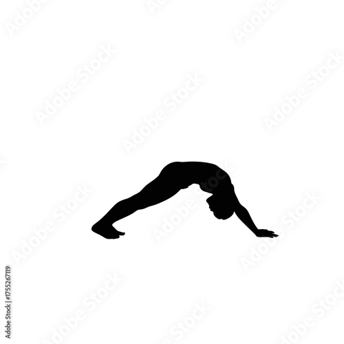 Silhouette of a person performing a yoga pose showing flexibility and strength in a dynamic posture