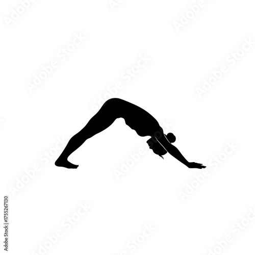 Silhouette of woman in downward facing dog yoga pose silhouette yoga exercise fitness body movement