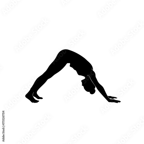Silhouette of a person practicing downward-facing dog yoga pose in a fitness studio