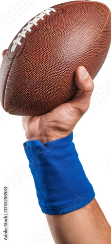 american football held by hand with blue wristband on white background.