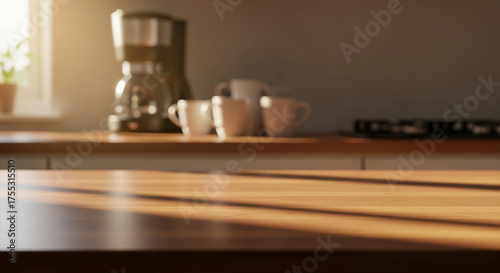 Warm Morning Light Illuminates a Modern Kitchen Countertop with Coffee Maker and Mugs.