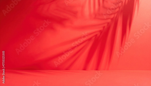 Blurred shadow from palm leaves on the red wall. Minimal abstract background for product presentation. Spring and summer.
