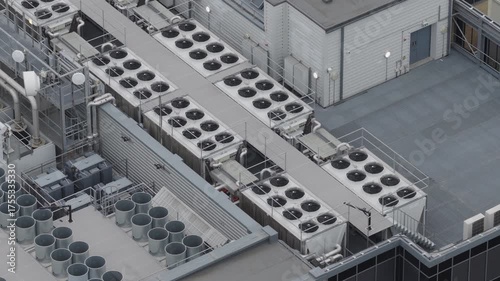 Aerial view of rooftop of data center with HVAC and ventilation systems. AI infrastructure and power consumption concept