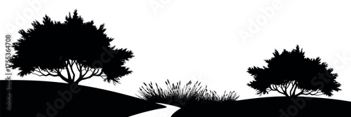 Silhouetted Trees and Path Through Rolling Hills Under a Bright Sky