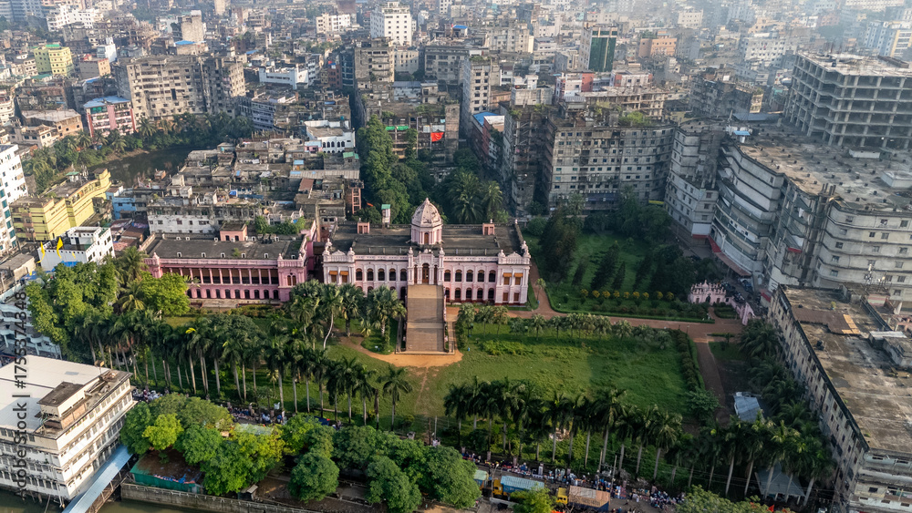 Fototapeta premium Aerial View of Mesmerizing Ahsan Manzil on the Bank of River Buriganga in Old Dhaka. Ahsan Manzil is located in Kumartoli along the banks of the Buriganga River in Dhaka, Bangladesh