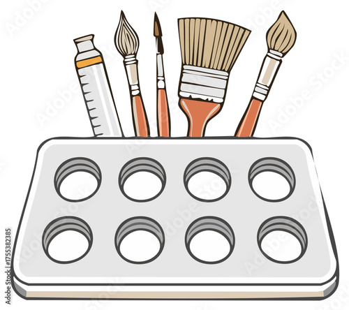 Artistic paint brushes and paint tube organized in a studio tool holder for creative projects