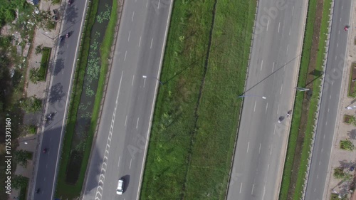 Aerial View of Ho Chi Minh City Road Traffic and Green Canal