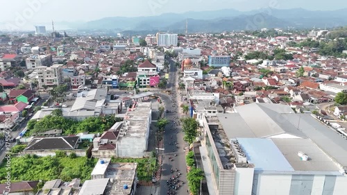 Bandar Lampung, Lampung, Indonesia - October 12, 2025: A drone's eye view captures the architectural structures and daily traffic flow in the city center.