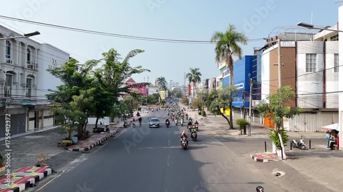 BANDAR LAMPUNG, INDONESIA - OCTOBER 12, 2025: An aerial perspective of the urban landscape of Bandar Lampung, capturing the downtown architecture and daily transportation flow.