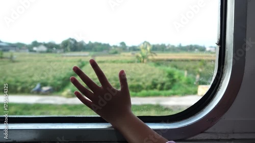 Child's Hand on the Train Window
