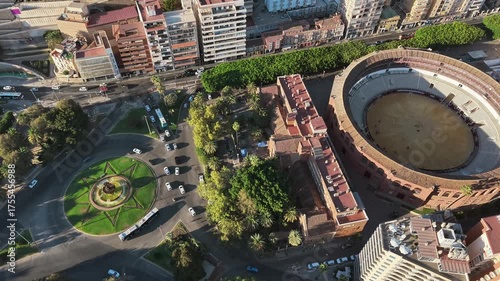 Top-down drone view of La Malagueta bullring arena and surrounded townscape, Málaga, Spain.
