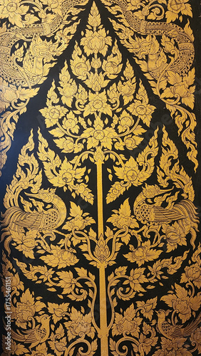 Wallpaper Mural Traditional Thai floral pattern with intricate gold leaf design on black background, featuring stylized flowers and mythical bird motifs in elegant symmetrical arrangement Torontodigital.ca