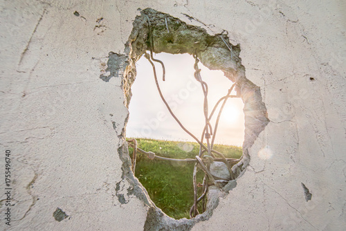 Sunlight Through Broken Wall  Hope and New Beginning
Breakthrough: Sun Rays Through Concrete Hole, Concept of Freedom
Light Beyond the Barrier  Optimism and Resilience