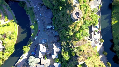 Esch-sur-Sure, Wiltz, Grand-Duche de Luxembourg, September 07, 2025, An aerial view shows a stunning historical tower amid lush nature and picturesque waterways, creating an idyll