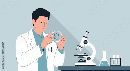 Scientist examining petri dish in lab with microscope and glassware for research purposes