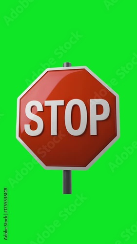 A clear three dimensional red octagonal stop sign with white lettering and a white border mounted on a grey pole isolated on a bright green background