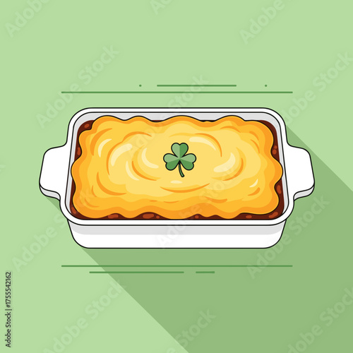 Delicious shepherd's pie in a white dish with a shamrock garnish on a green background