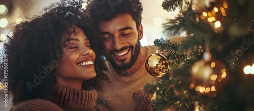 Couple decorating Christmas tree