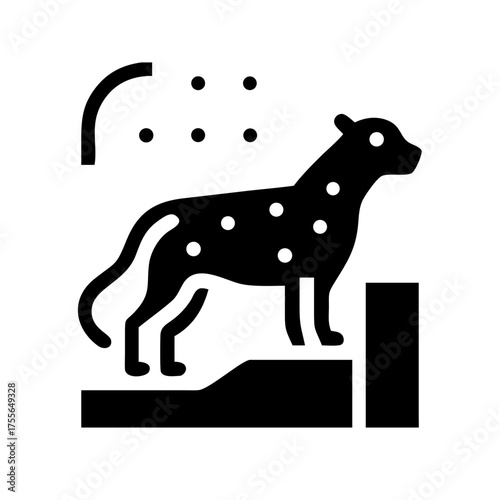 A spotted hyena standing on a rock