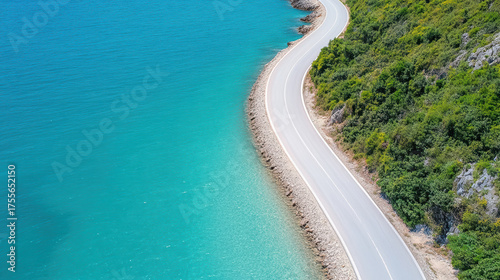 Wallpaper Mural Winding coastal road along turquoise sea and rocky shoreline creates serene landscape Torontodigital.ca