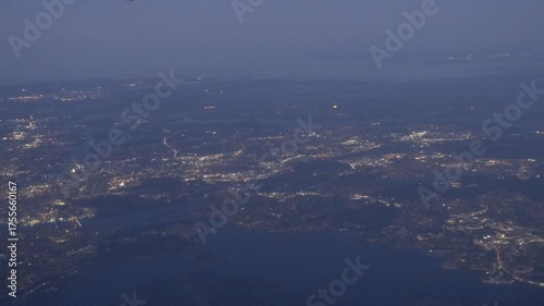 Stockholm, Sweden A plane flies over the suburbs in the early morning. 