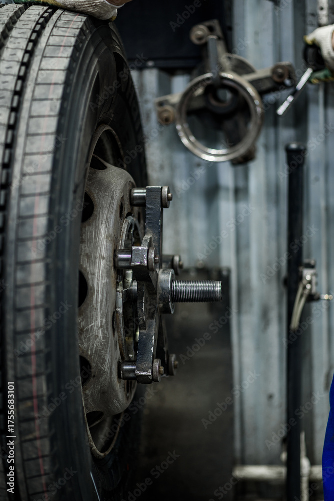 Fototapeta premium the process of repairing and balancing car tires