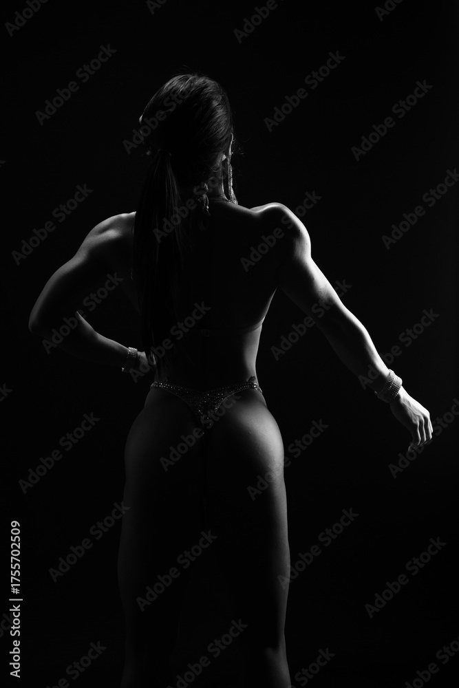 Naklejka premium Bodybuilder lifestyle gym stretching workout pose strong female back muscle silhouette fitness