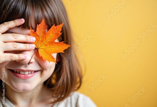 Autumn mood, happy smiling girl closes her eye with fall maple leaf, on yellow background, promo poster template for seasonal autumn marketing, sale