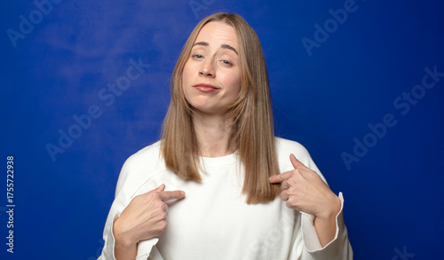 looking proud, arrogant, happy, surprised and satisfied, pointing to self, feeling like a winner
