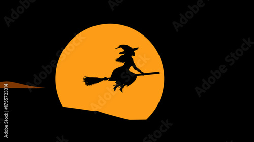 Silhouette of a witch flying on a broomstick against a large, bright orange moon