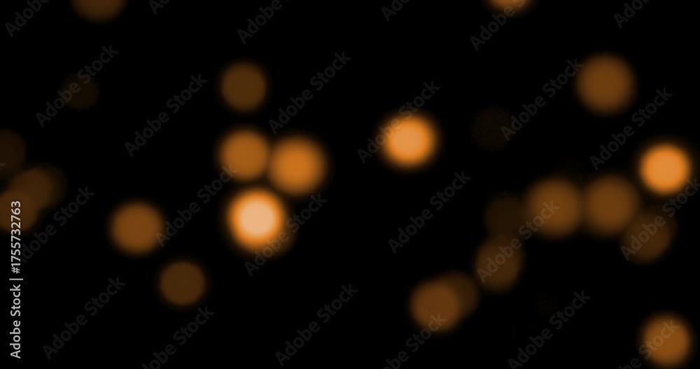 christmas gold gradient sparkle glitter dust particles from top on black background with bokeh flowing movement, golden holiday happy new year and valentine day love