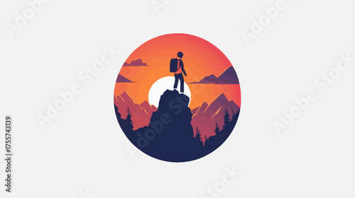 Hiker stands atop peak against sunlit mountain landscape