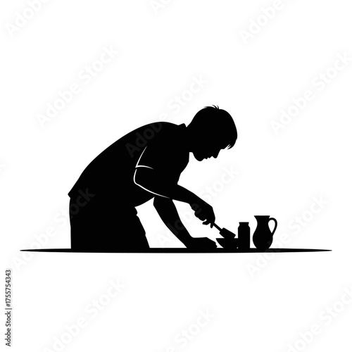 Dedicated craftsman skillfully shaping clay on pottery wheel, creating art with focus and precision