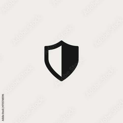 A stark black and white shield icon symbolizes protection and security