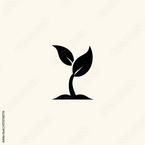 Minimalist black seedling with two leaves emerging from soil against light background