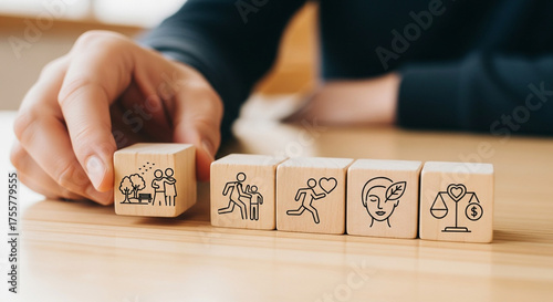 Conceptual wooden blocks illustrate holistic life balance including family, health, wellness, and financial stability for a fulfilling existence
