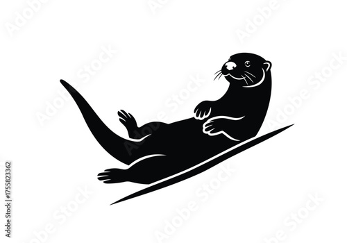 Black otter sliding down a slope on its back, capturing a playful moment isolated on white