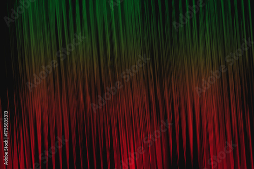 Abstract vertical stripes of green and red light with dark background