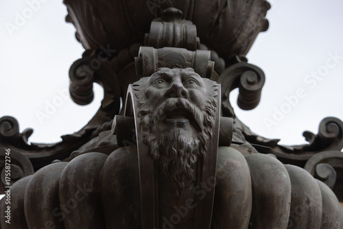 Schilderij op canvas Black cast iron bas-relief, Baroque-style sculpture with stucco elements featuri