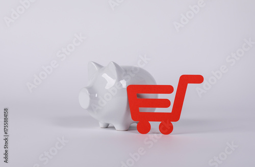 A white piggy bank next to ...
